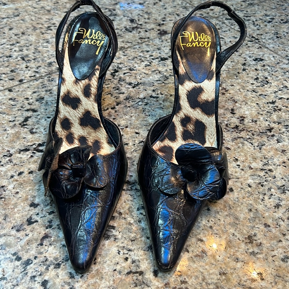 Brown crocodile embossed heeled sling back mules with flower accents. So pretty!